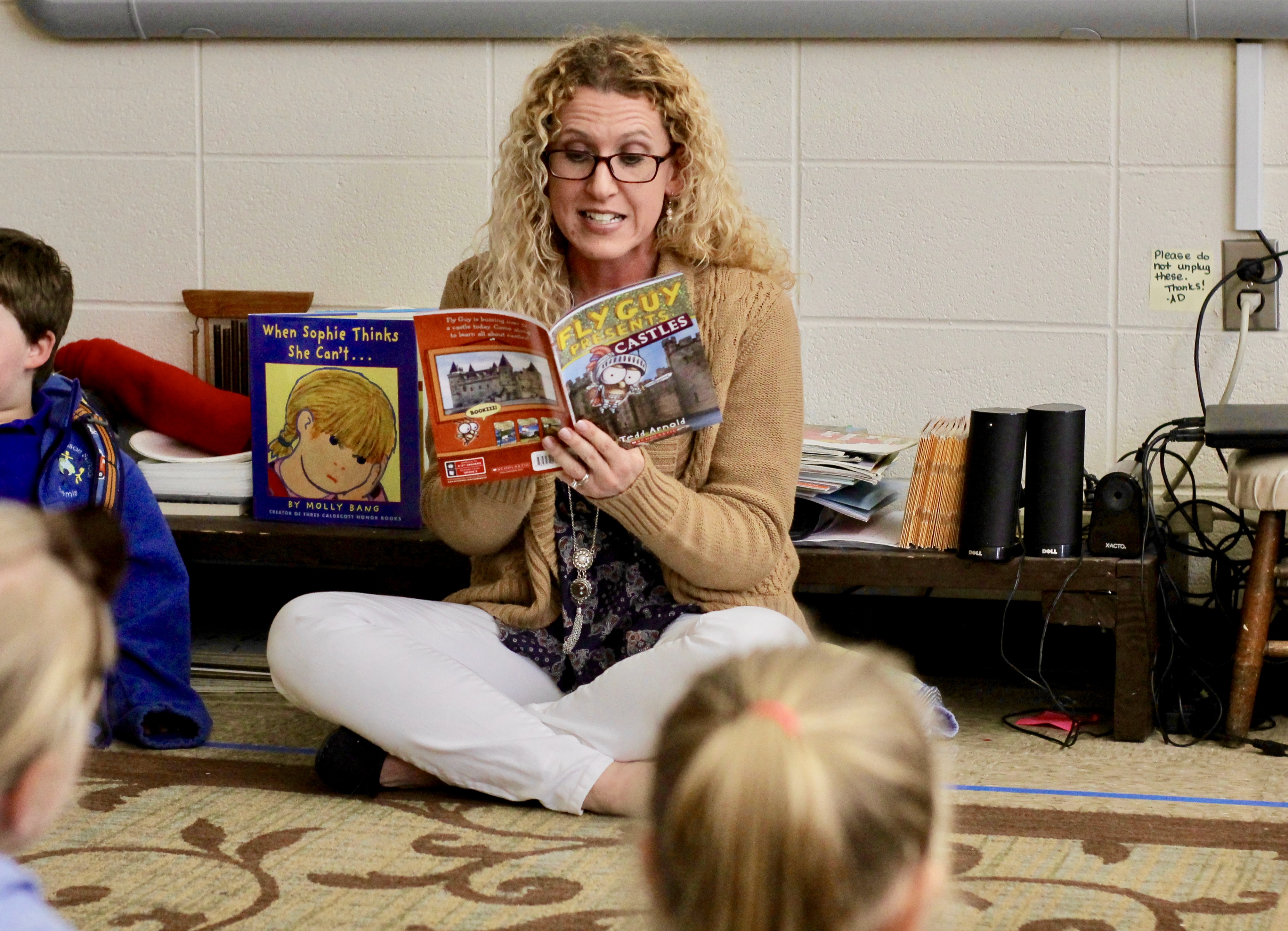 Teacher Ayme Davis reads to her students. Teacher Ayme Davis reads to her students.